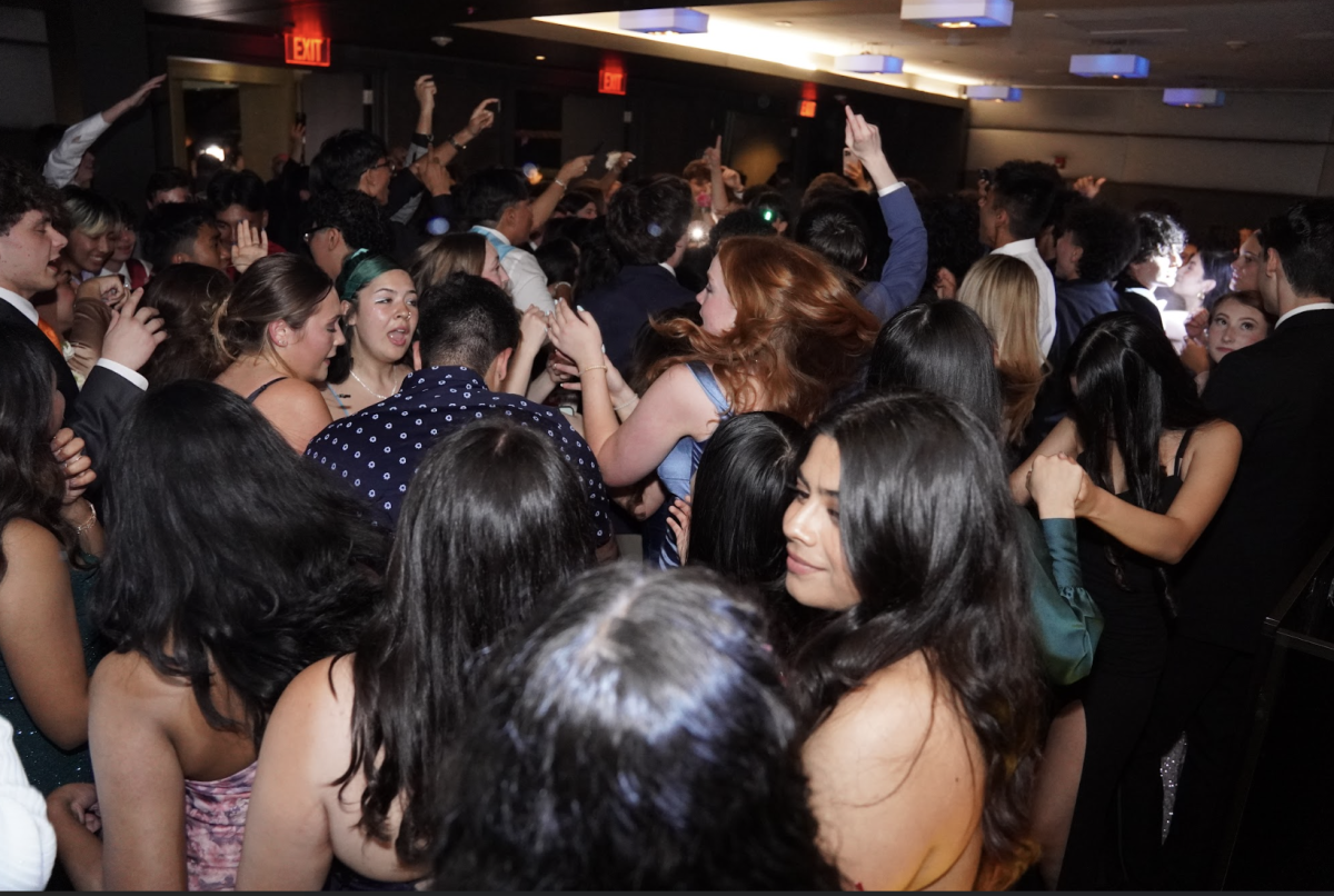 Juniors pack the dance floor at the prom.